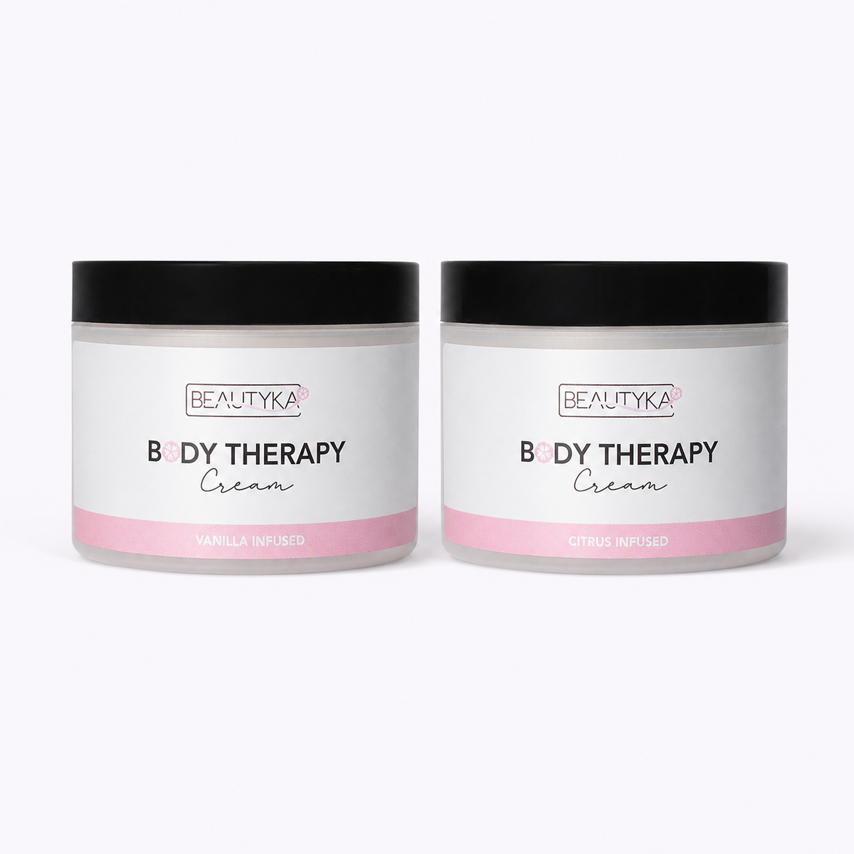 Beautyka Body Therapy Nourishing Cream jars in citrus and vanilla on a neutral off-white background.