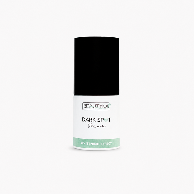 A white bottle of Beautyka Dark Spot Correcting Serum with a black cap on a plain white background.