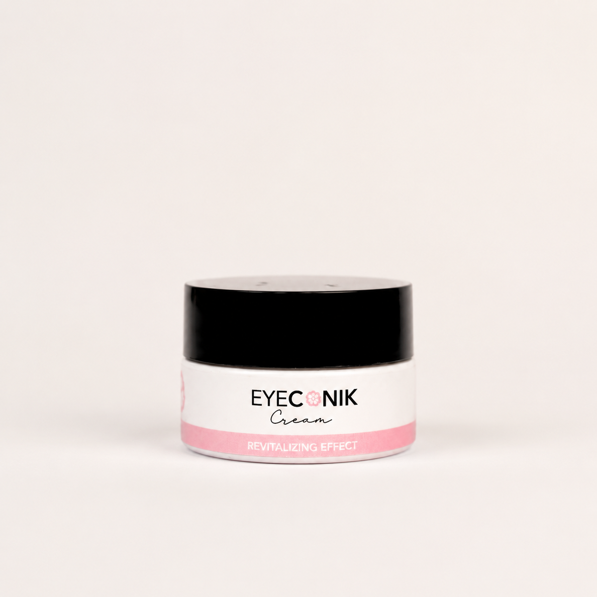 A small jar of Beautyka Eyeconik Eye Cream with a black lid and pink accents on an off-white background.