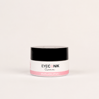A small jar of Beautyka Eyeconik Eye Cream with a black lid and pink accents on an off-white background.