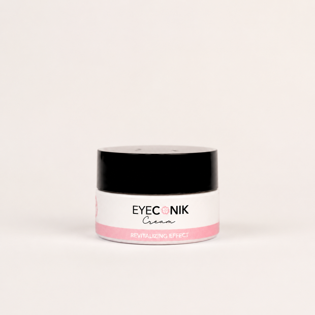 A small jar of Beautyka Eyeconik Eye Cream with a black lid and pink accents on an off-white background.