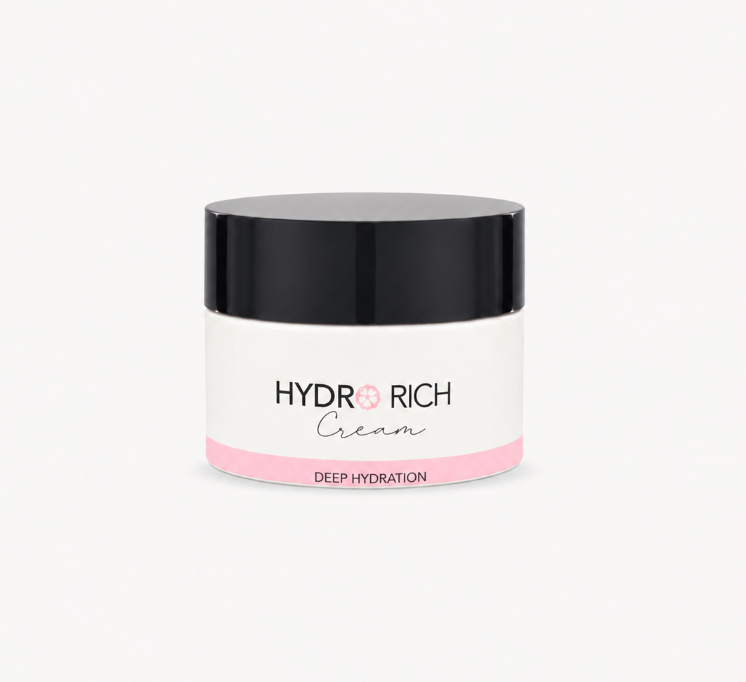 A jar of HYDR RICH Cream with a black lid, white body, and pink accent band, centered on a light gray background.