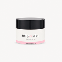 A jar of HYDR RICH Cream with a black lid, white body, and pink accent band, centered on a light gray background.