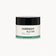 A jar of Overnight Bloom Mask Glow Recovery on a clean white background. The product features a white jar with a black lid and a teal accent band on the label.