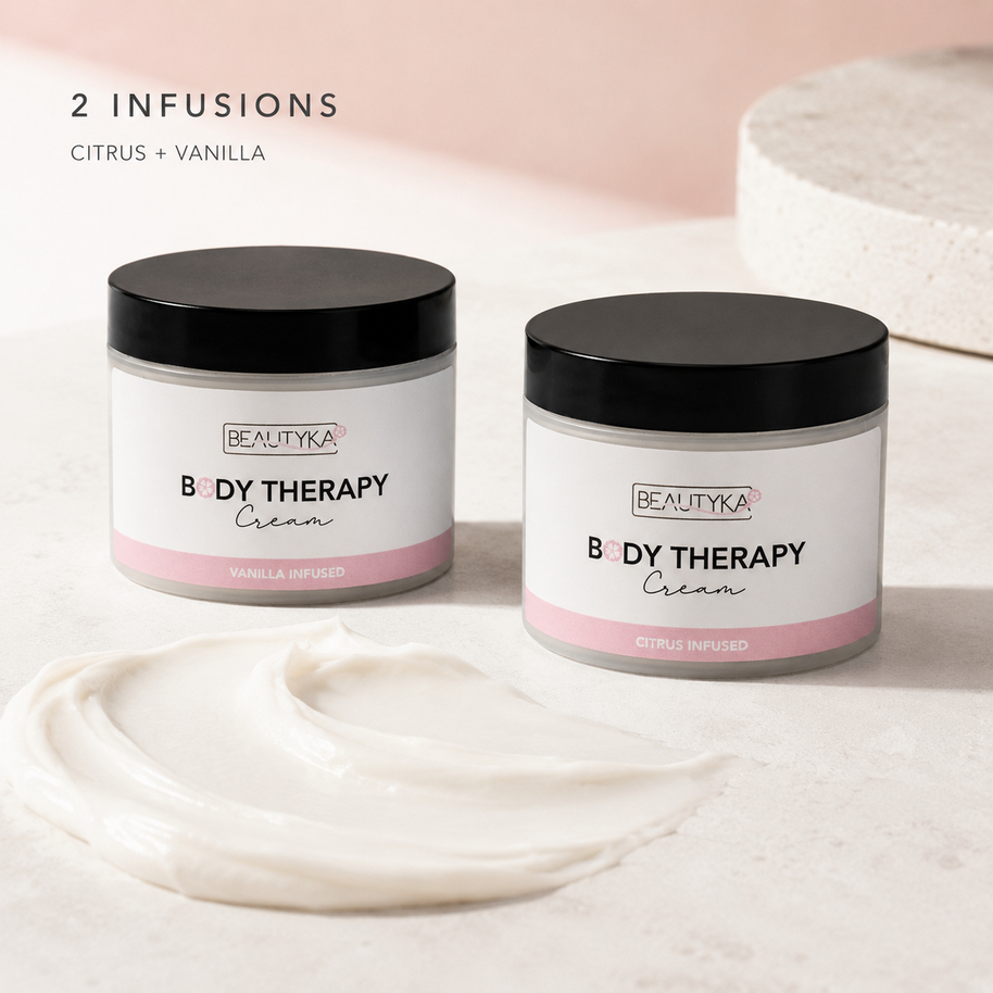 Beautyka Body Therapy Nourishing Cream jars styled with a smear of the cream on a light surface.