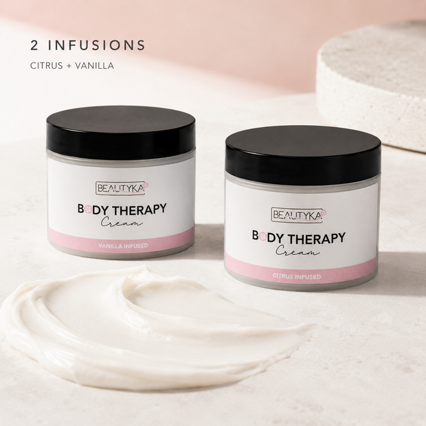 Beautyka Body Therapy Nourishing Cream jars styled with a smear of the cream on a light surface.