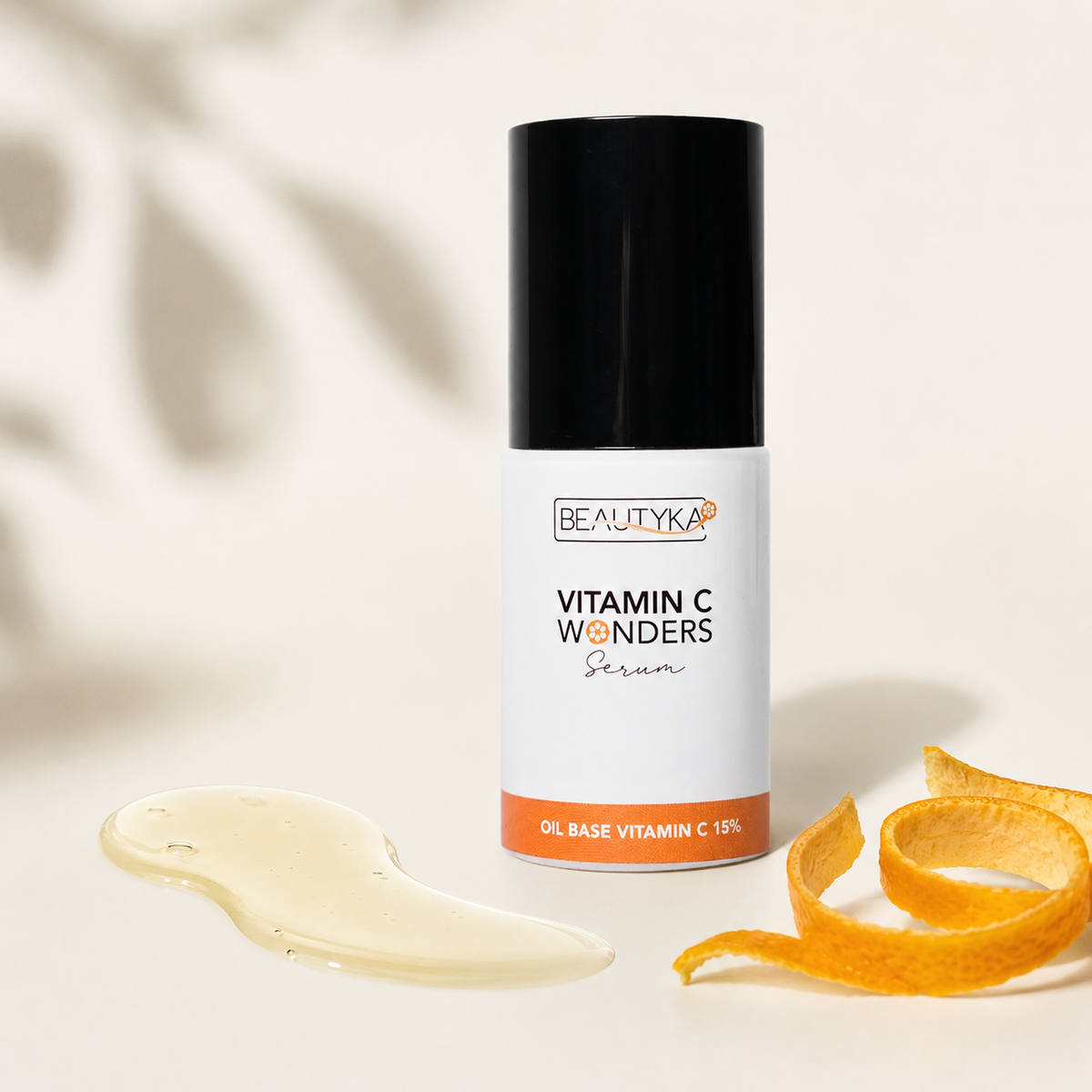 Beautyka Vitamin C Wonders Oil Serum styled with a smear of pale yellow serum and orange peel on a warm beige background.