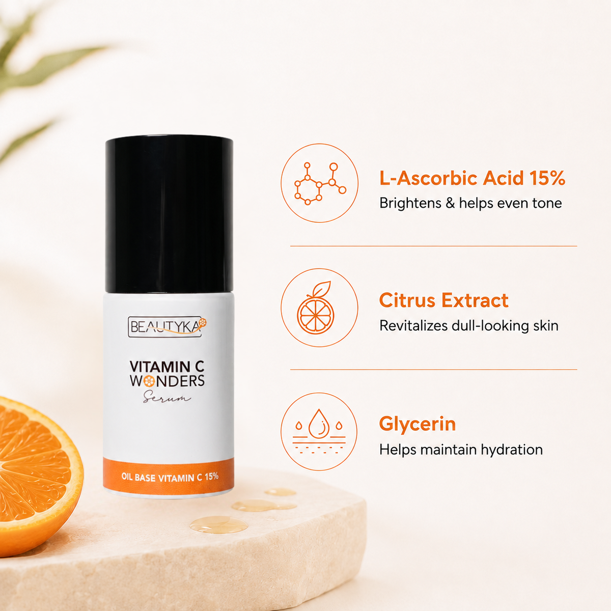 Beautyka Vitamin C Wonders Oil Serum on a light stone slab with an orange slice and callouts for L-ascorbic acid, citrus extract and glycerin.