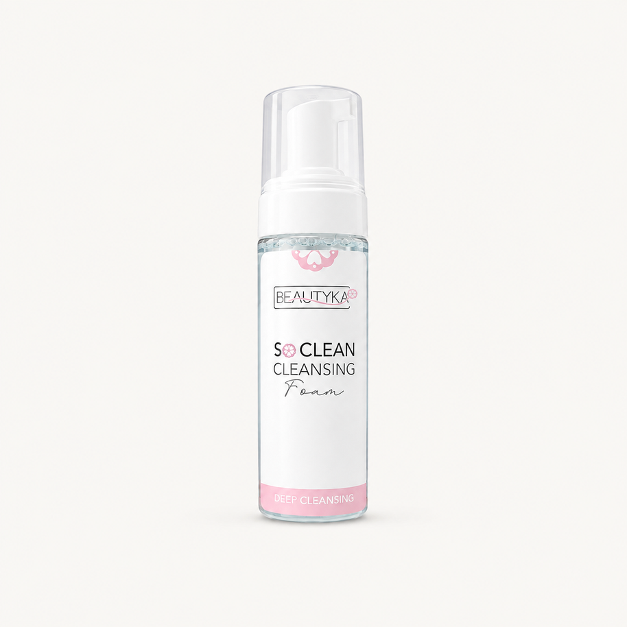 A bottle of BEAUTYKA So Clean Cleansing Foam on a clean, solid off-white background. The bottle is clear with a white pump dispenser and features a white label with pink and black text.