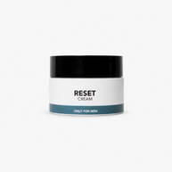 A white cosmetic jar with a black lid and a teal band at the bottom, labeled 'RESET CREAM' and 'ONLY FOR MEN' on a clean white background.