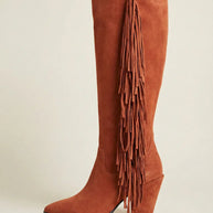 Brown suede knee-high boot with fringe detail and chunky heel