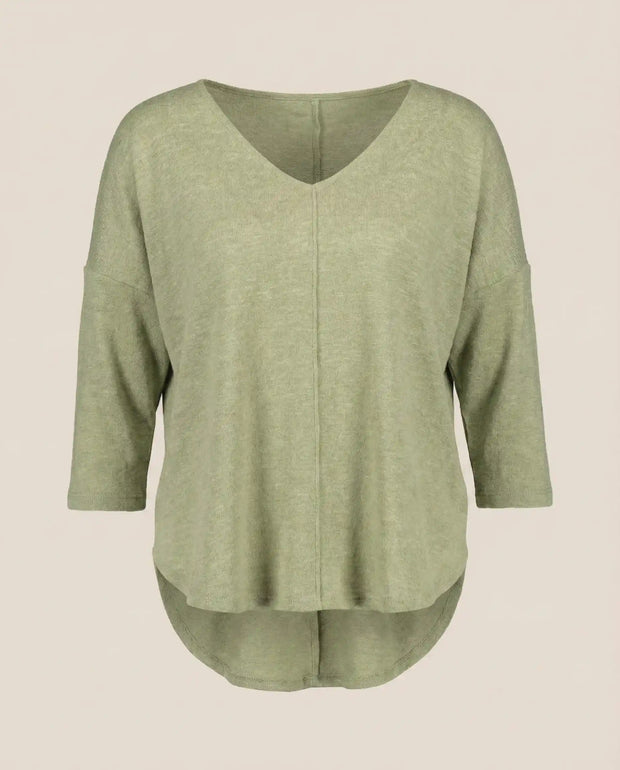 Light green V-neck long sleeve knit top with high-low hem and seam detail