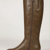 Brown knee-high leather boot with side zipper on white background