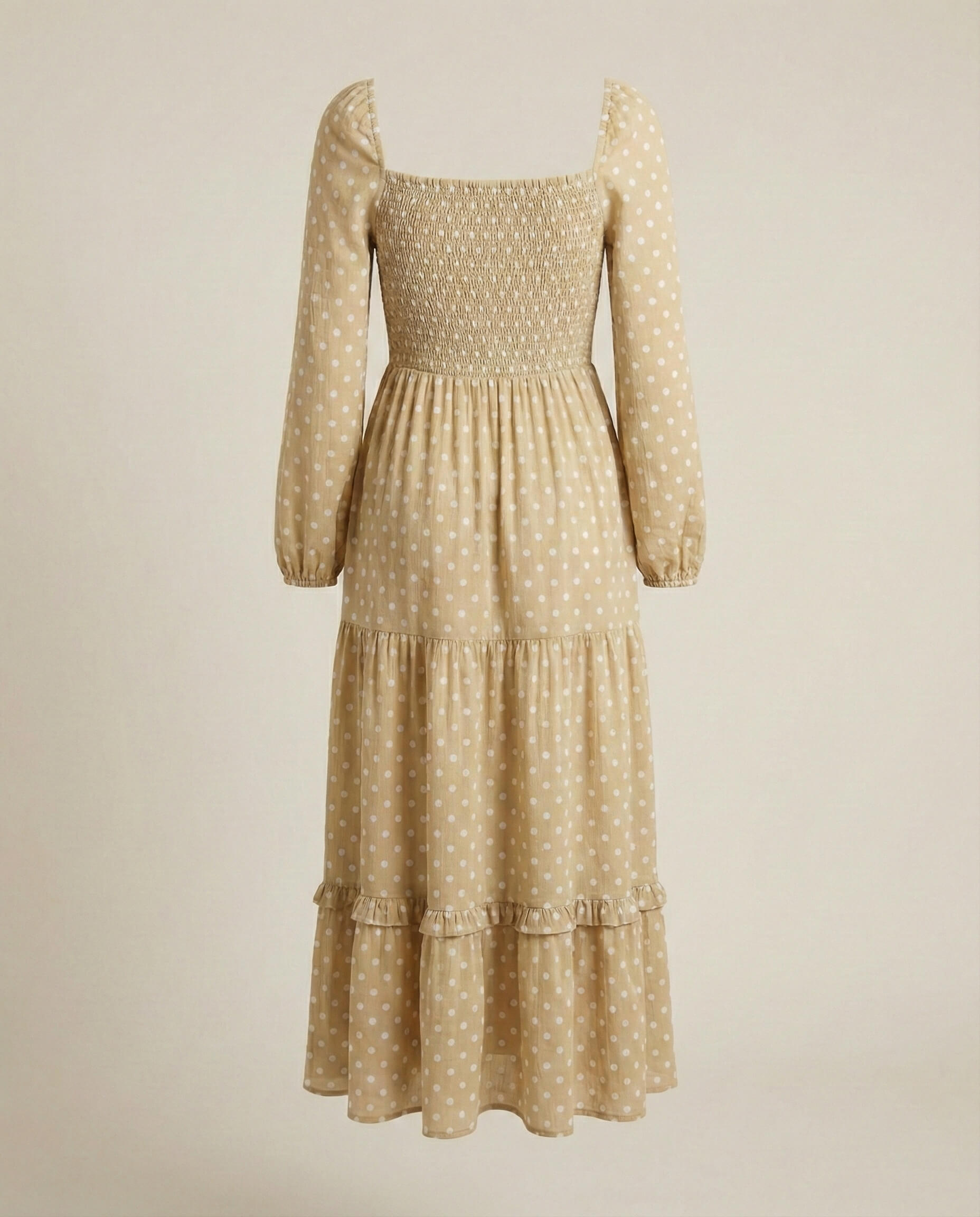 Beige long-sleeve midi dress with white polka dots and tiered ruffle skirt