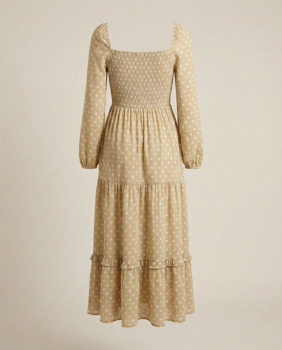 Beige long-sleeve midi dress with white polka dots and tiered ruffle skirt