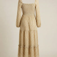 Beige long-sleeve midi dress with white polka dots and tiered ruffle skirt