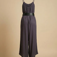 Sleeveless black jumpsuit with wide leg pants, thin straps, and wide black belt