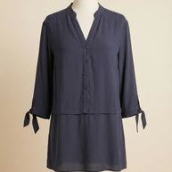 Navy blue tunic blouse with V-neck, button front, 3/4 sleeves, and tie cuffs