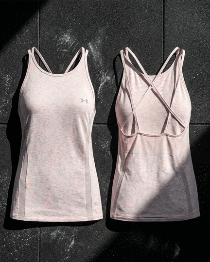 Light pink women’s athletic tank tops with racerback and crisscross straps, front and back view.