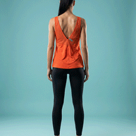 Woman in red Under Armour tank top and black leggings, back view, on blue background