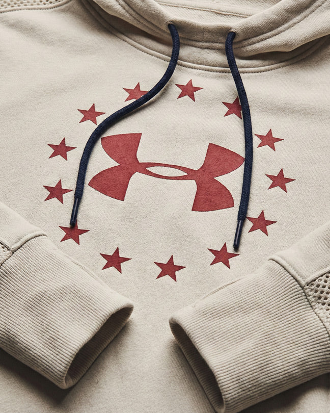 Beige hoodie with red star circle and large central logo, black drawstrings, mesh sleeve detail