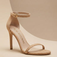 Beige suede high heel sandal with ankle strap and open toe on neutral background