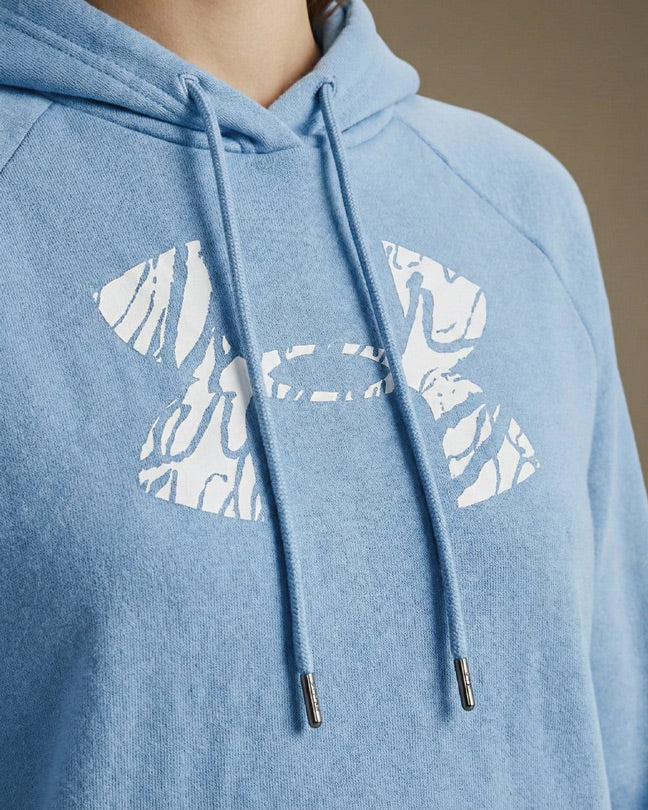 Light blue hoodie with white textured graphic logo and drawstrings, closeup view