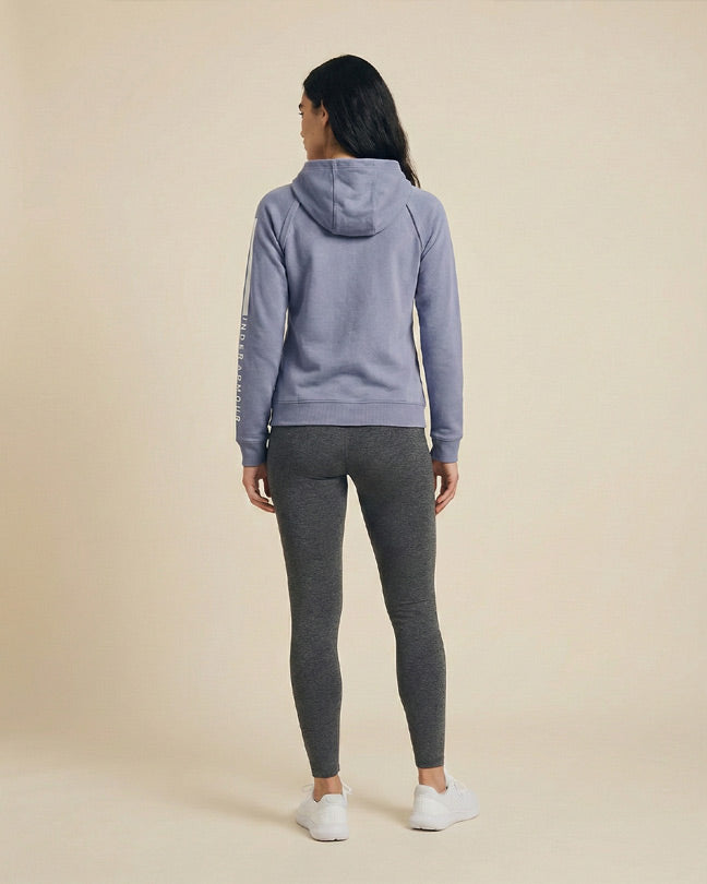 Woman in lavender hoodie and gray leggings, standing, casual activewear style