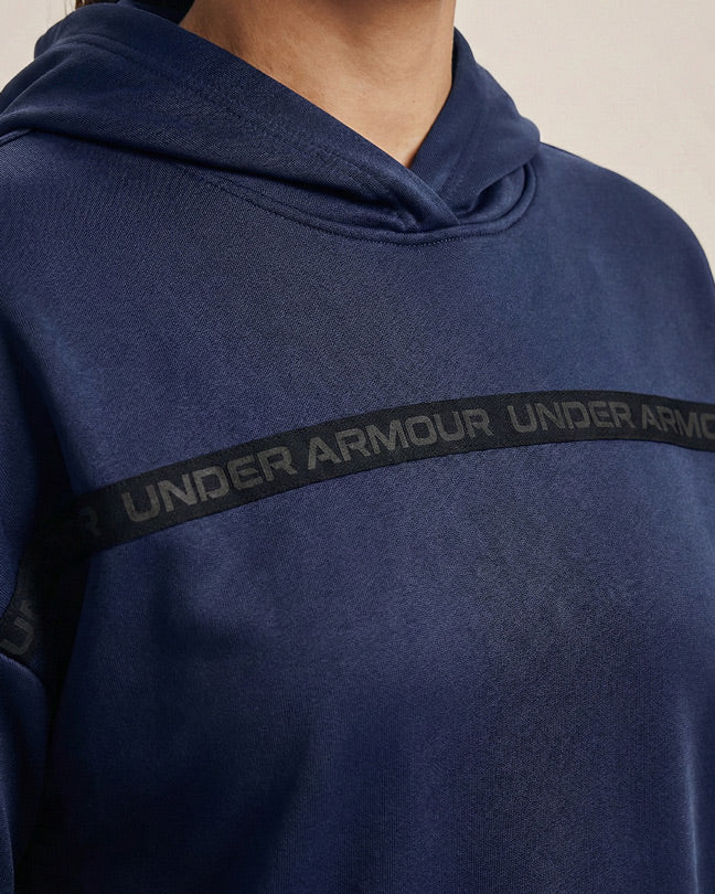 Close-up of navy blue Under Armour hoodie with black logo stripe across chest