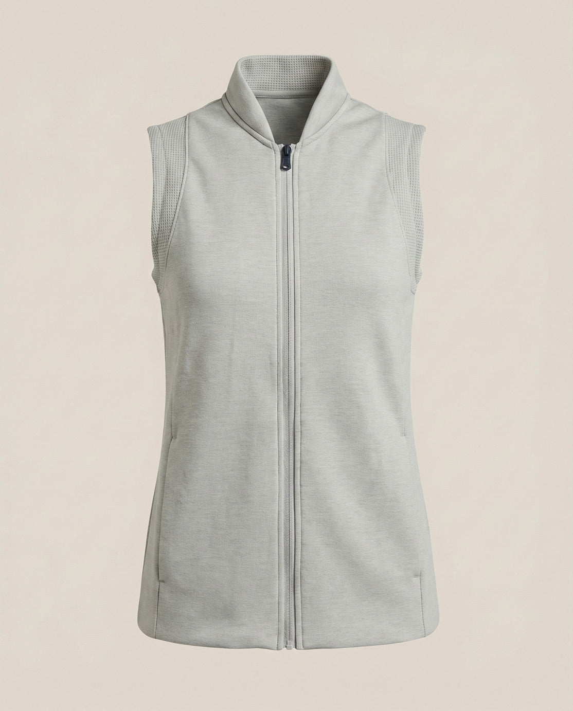 Light gray sleeveless top with front zipper and stand collar, athletic casual style