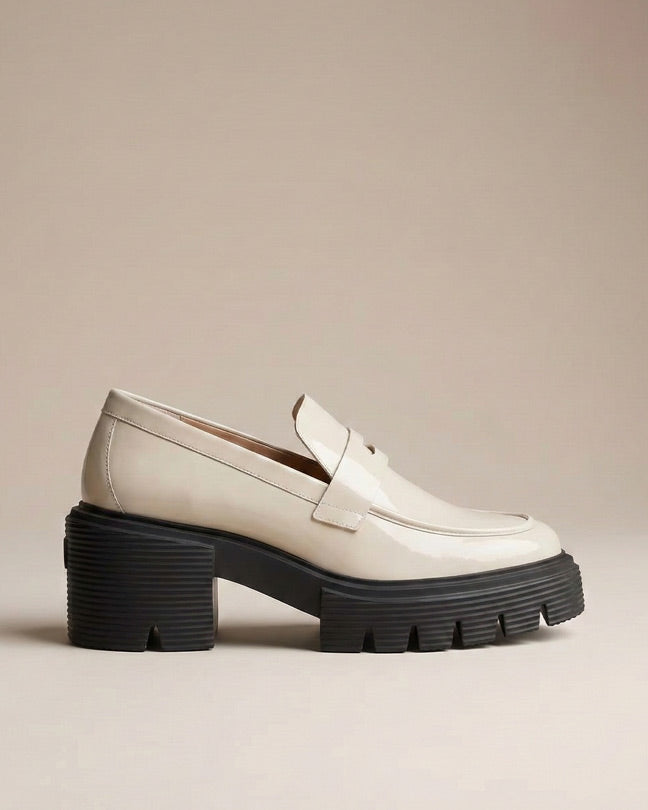 Chunky sole beige loafer shoe with thick black platform, modern slip-on design