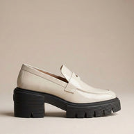 Chunky sole beige loafer shoe with thick black platform, modern slip-on design