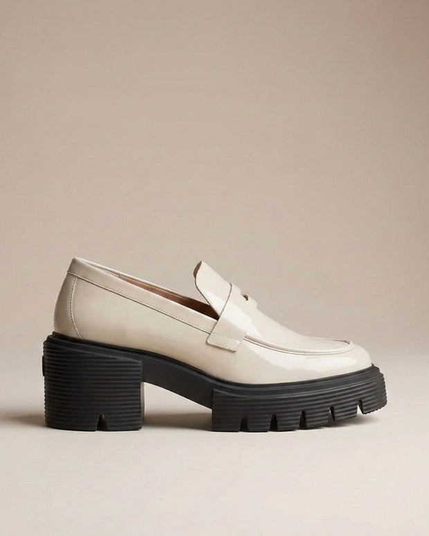 Chunky sole beige loafer shoe with thick black platform, modern slip-on design