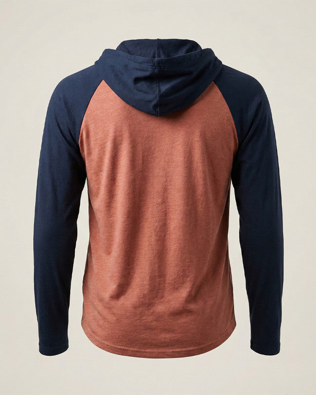 Back view of a two-tone hoodie with navy sleeves and hood, rust-colored body, long sleeves