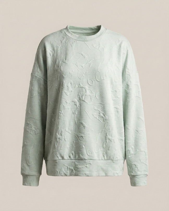 Light green textured crewneck sweatshirt with subtle embossed pattern, long sleeves
