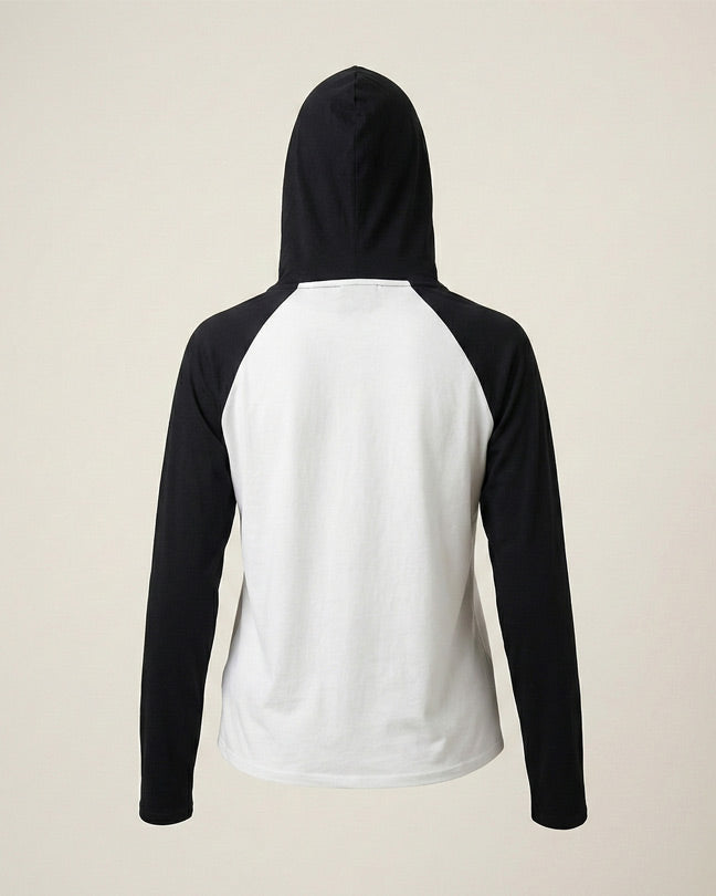 Back view of a black and white long sleeve hoodie on plain background
