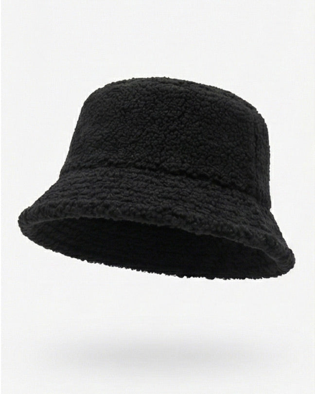 Black fleece bucket hat with textured fabric on a white background
