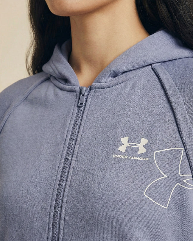 Woman wearing a light purple Under Armour zip-up hoodie with logo on chest