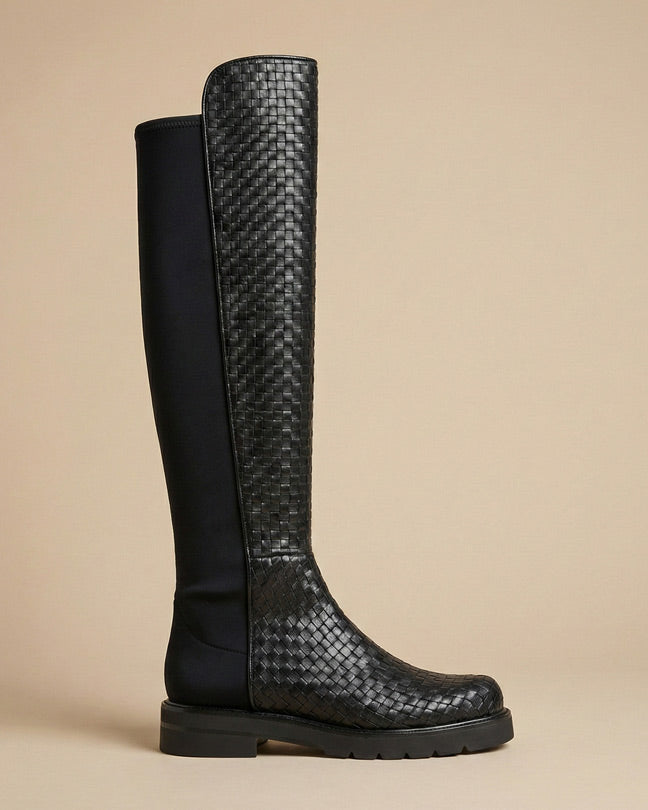Black knee-high boot with woven leather texture and stretch fabric panel
